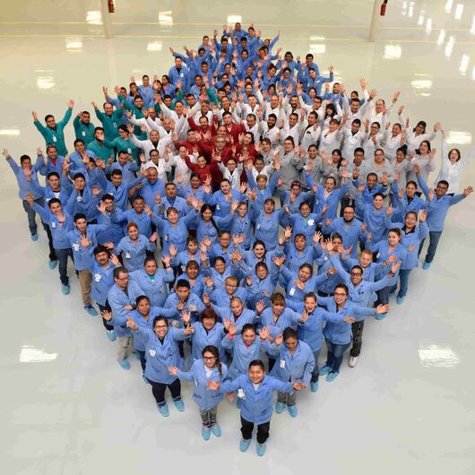 The Milwaukee Electronics team gathered outside the facility